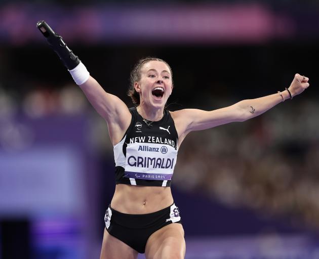 Anna Grimaldi celebrates after winning bronze during the women's T47 100m final. PHOTOS: FIONA...