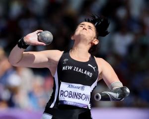 Holly Robinson strives for distance in the F46 shot put final at the Paralympics in Paris. PHOTOS...