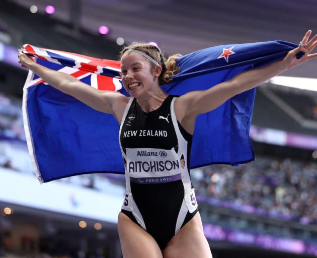 Danielle Aitchison celebrates her silver medal in the T36 100m final.