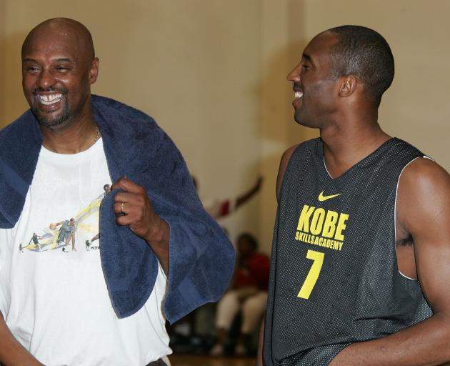 Kobe and Joe Bryant (left) share a laugh at the Kobe Basketball Academy in 2007. Photo: Getty Images