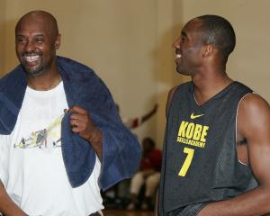 Kobe and Joe Bryant (left) share a laugh at the Kobe Basketball Academy in 2007. Photo: Getty Images