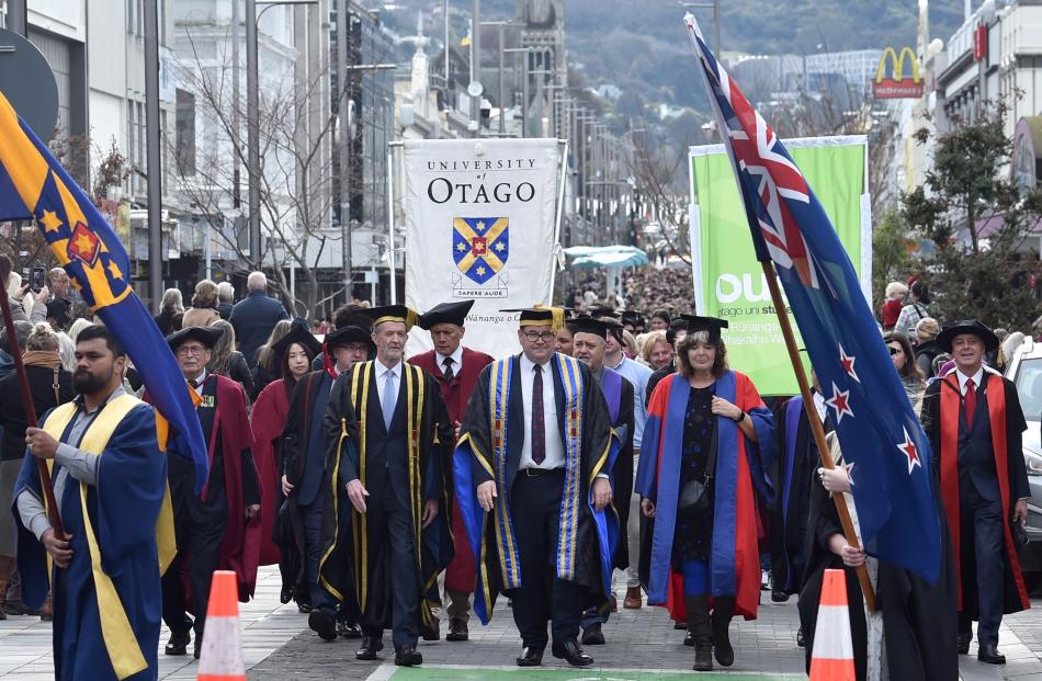 University of Otago vice-chancellor Grant Robertson leads graduands down George St. 