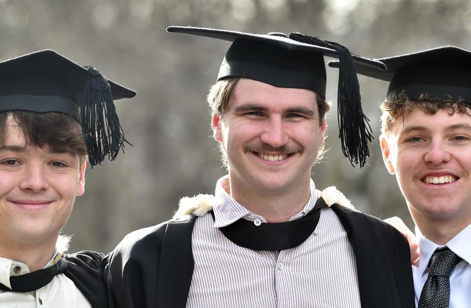 University of Otago new graduates (from left) Lewis Wall and Caleb Moody, of Dunedin, and Riley...