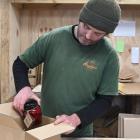 Gus Hayden’s new logistics shed gives him space to label his Augustine’s of Central preserves....