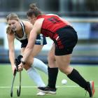 Sarah Jennings (Kings United, left) and Grace Milne (Momona) battle for possession at the...