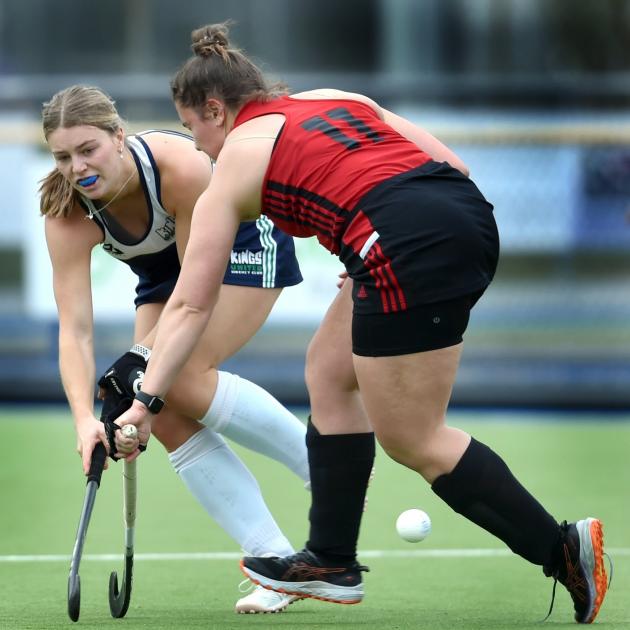 Sarah Jennings (Kings United, left) and Grace Milne (Momona) battle for possession at the...