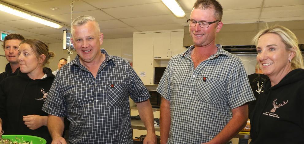 Feeding the masses ... Serving diners at a community dinner last year are North Canterbury...