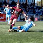 Coastal Spirit’s Sako Satsumi wins the ball off Universities’ Hunter Hine during his side’s 2-1...