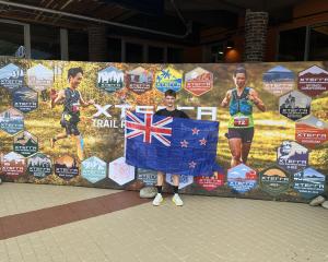 Dunedin runner Dan Hayman flies the New Zealand flag at the Xterra world trail half-marathon...