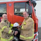 James Hazlett (right) hands over Ranfurly’s fire chief responsibilities to William Dowling. PHOTO...