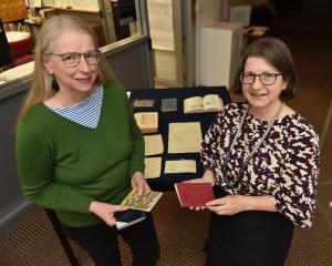 Anna Blackman (left) and Kirstie Ross with Janet Frame ephemera. Photo: Gregor Richardson