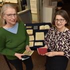 Anna Blackman (left) and Kirstie Ross with Janet Frame ephemera. Photo: Gregor Richardson