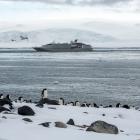 The 'Le Soleal' cruise ship docked in Antarctica, with some penguins in the foreground. PHOTO:...