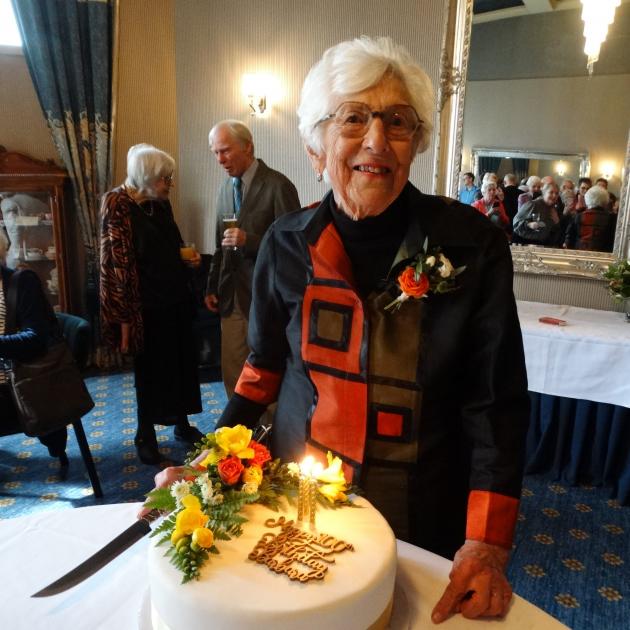 Barbara Simpson prepares to cut her birthday cake adorned in her favourite colours at the Brydone...