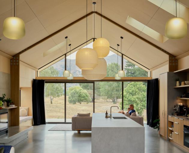 The view through the main living pavilion to a local park.