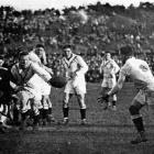 An English player offloads during the rugby league test against the Kiwis in 1924 while...