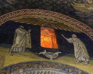 The sun glows through alabaster windows in Galla Placidia.