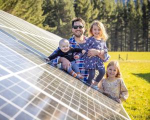 Golden Bay dairy and solar farmer Hamish Hills at the family’s 3000-panel solar farm with 1-year...