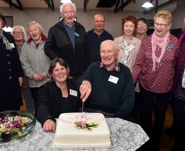 Linda Hellyer, then ORS president, and life member Bob Grant cut the society’s 70th anniversary...