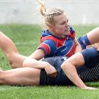 Columba College fullback Pip Eason goes over to score a try while held by Central Southland...