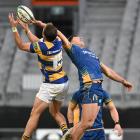 Otago wing Josh Whaanga is at full stretch to steal the high ball from Bay of Plenty fullback...