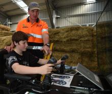 Balclutha’s Mike Hurring Logging and Contracting employee Josh Hurring shows Dunedin school pupil...