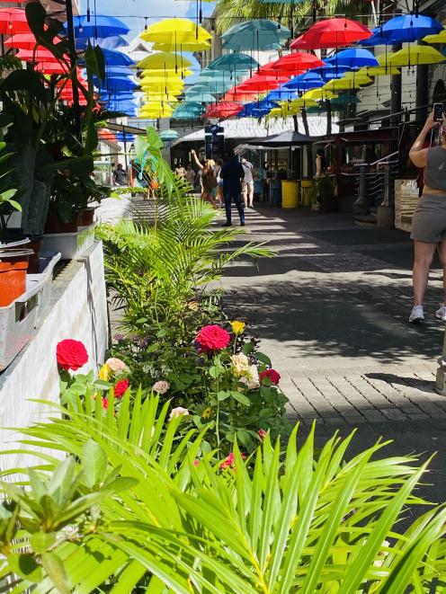 Visitors view a colourful panorama at the Central Market in Port Louis.