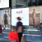 Signs in George St outside the Wall St Mall tease the arrival of Seed Heritage to the city.