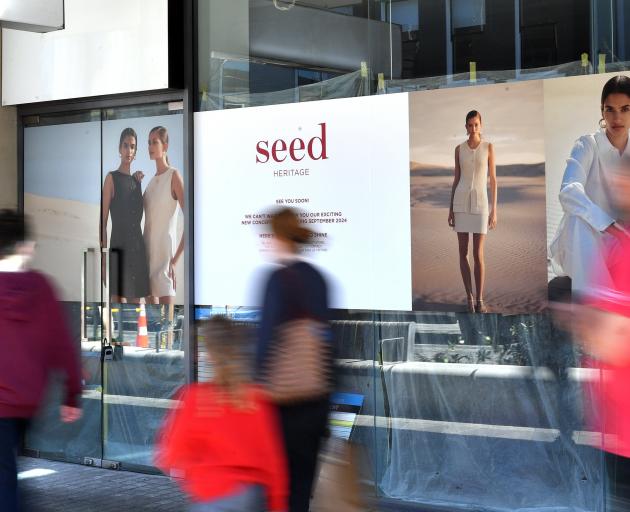 Signs in George St outside the Wall St Mall tease the arrival of Seed Heritage to the city.