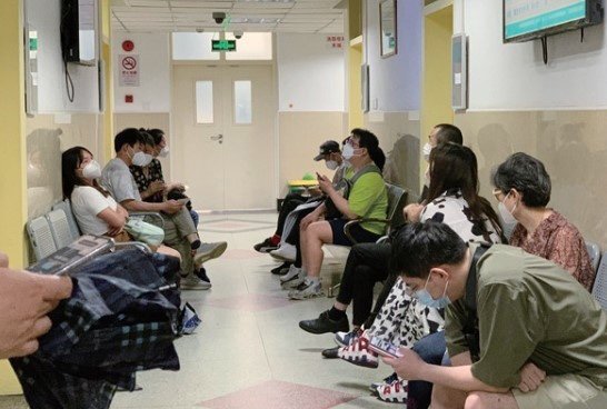 Patients wait for treatment at Shanghai Mental Health Center. Photo: Caixin