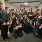 Southland Youth Jazz Band celebrate their success after their winning performance at the Southern...