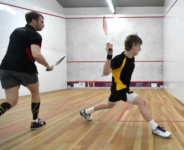 Canterbury’s Oliver Johnston (left) volleys against Wellington’s Oliver Dunbar during the final...