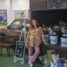 Chrissie Hart stands in front of the truck which she takes to events to sell bouquets. PHOTOS:...