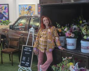 Chrissie Hart stands in front of the truck which she takes to events to sell bouquets. PHOTOS:...