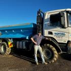 Bailey Mitchell, of Total Transport Otago Ltd, with one of the trucks that will be on display...