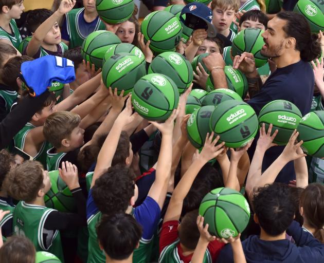 NBA star Steven Adams signs autographs during a Community Camp at the Edgar Centre yesterday....