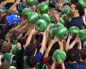 NBA star Steven Adams signs autographs during a Community Camp at the Edgar Centre yesterday....