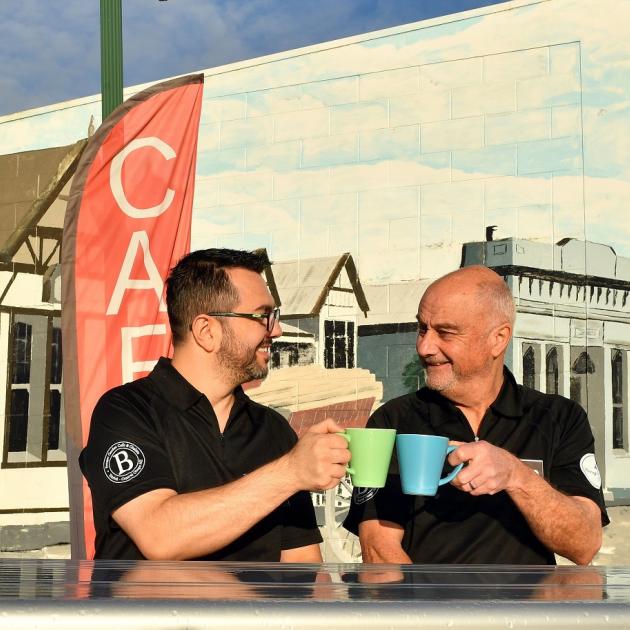 Leandro Massariolo (left) and John Tomkins celebrate opening the only cafe in Tapanui. Photo:...