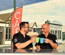 Leandro Massariolo (left) and John Tomkins celebrate opening the only cafe in Tapanui. Photo:...