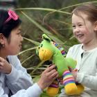 University of Otago second year medical student Hayley Wong, 19, examines "Giraffey" held in the...