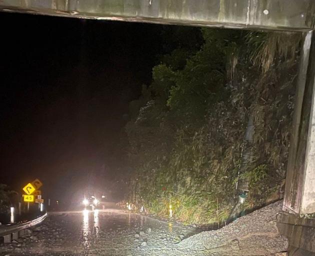 Snow and heavy rain triggered a rockfall that overflowed onto the road at the western end of the...