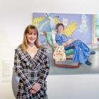 Former St Hilda's Collegiate student, Imogen Corbett, in front of her portrait of Natalia Hughes...