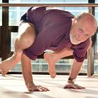 With 50 years of yoga practice and teaching under his belt, Wayne Everson pushes into a bakasana ...