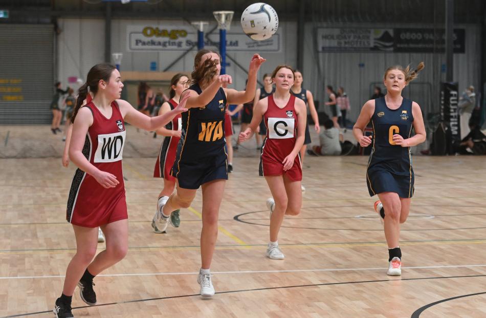 Taieri College wing attack Janaya Guthrie sends the ball down court in front of Logan Park High...