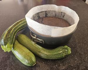 To dehydrate your zucchinis, grate them and squeeze out as much juice as you can. Photo: Hilary...